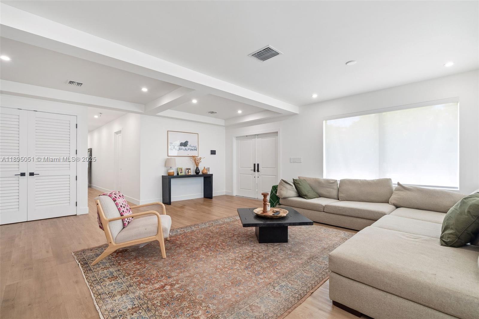 8121 Southwest 97th Terrace Miami, FL 33156 - Photo 22 of 38 a living room with furniture and a wooden floor