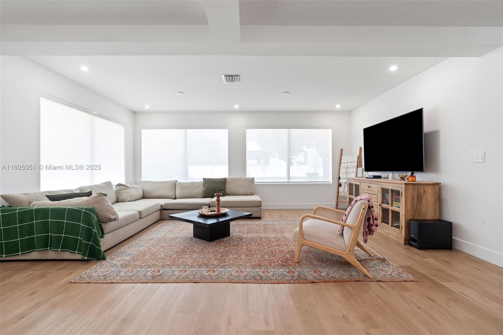 8121 Southwest 97th Terrace Miami, FL 33156 - Photo 23 of 38 a living room with furniture and a flat screen tv