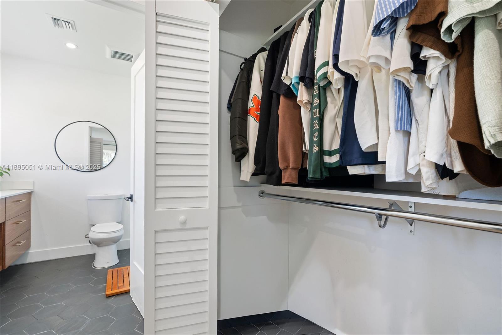 8121 Southwest 97th Terrace Miami, FL 33156 - Photo 27 of 38 a view of walk in closet with clothes and shoes