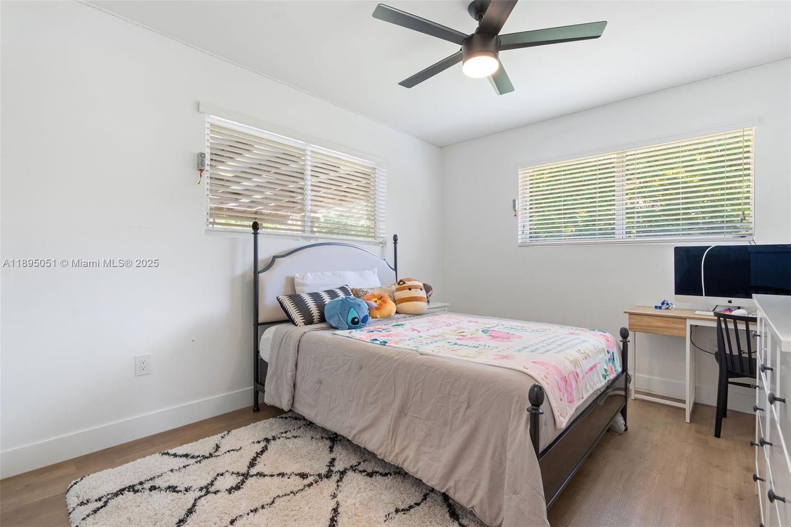 8121 Southwest 97th Terrace Miami, FL 33156 - Photo 30 of 38 a bedroom with a bed and a window