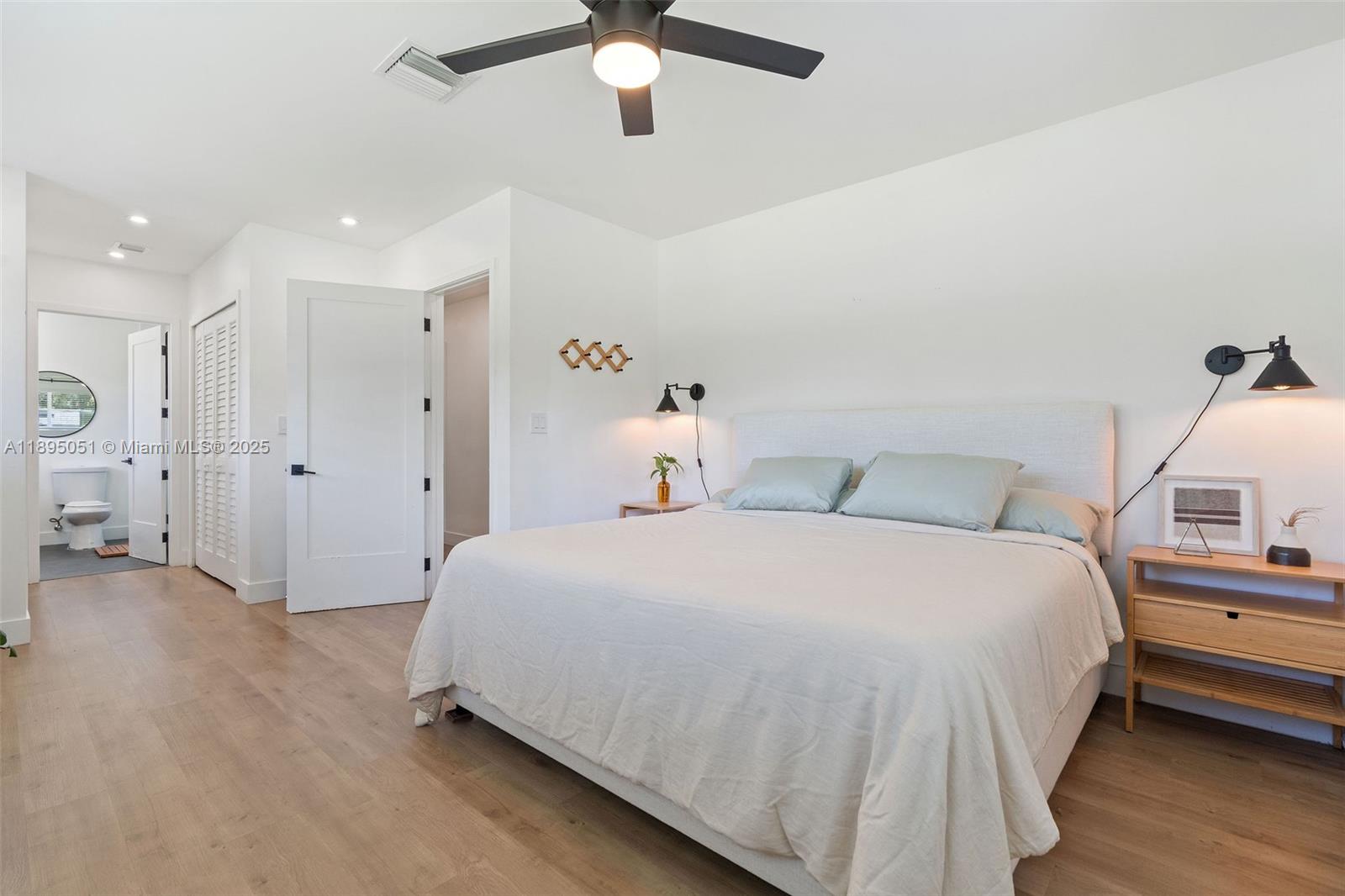 8121 Southwest 97th Terrace Miami, FL 33156 - Photo 31 of 38 a bedroom with a bed and a chandelier