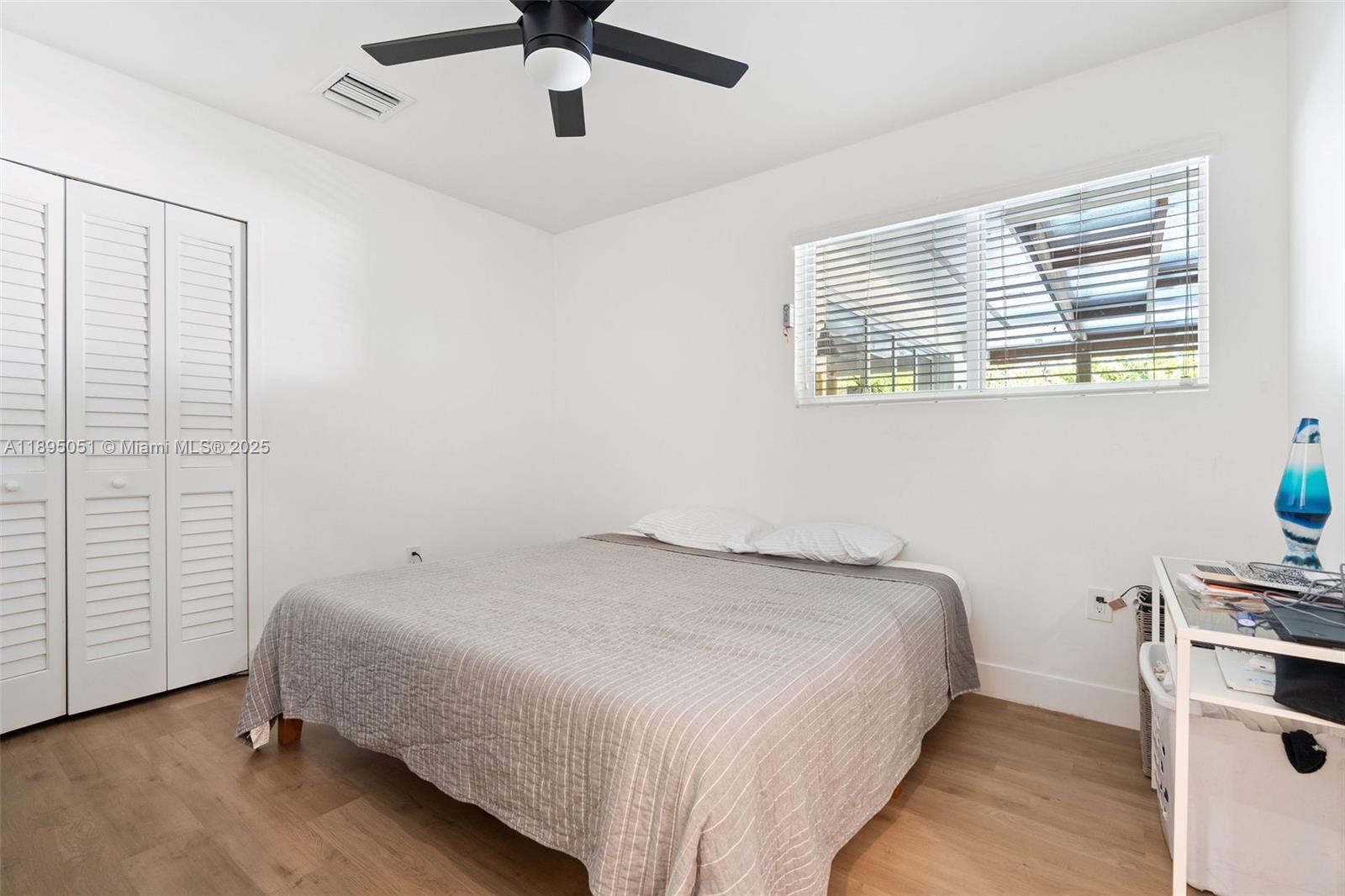 8121 Southwest 97th Terrace Miami, FL 33156 - Photo 32 of 38 a bedroom with a bed and a window