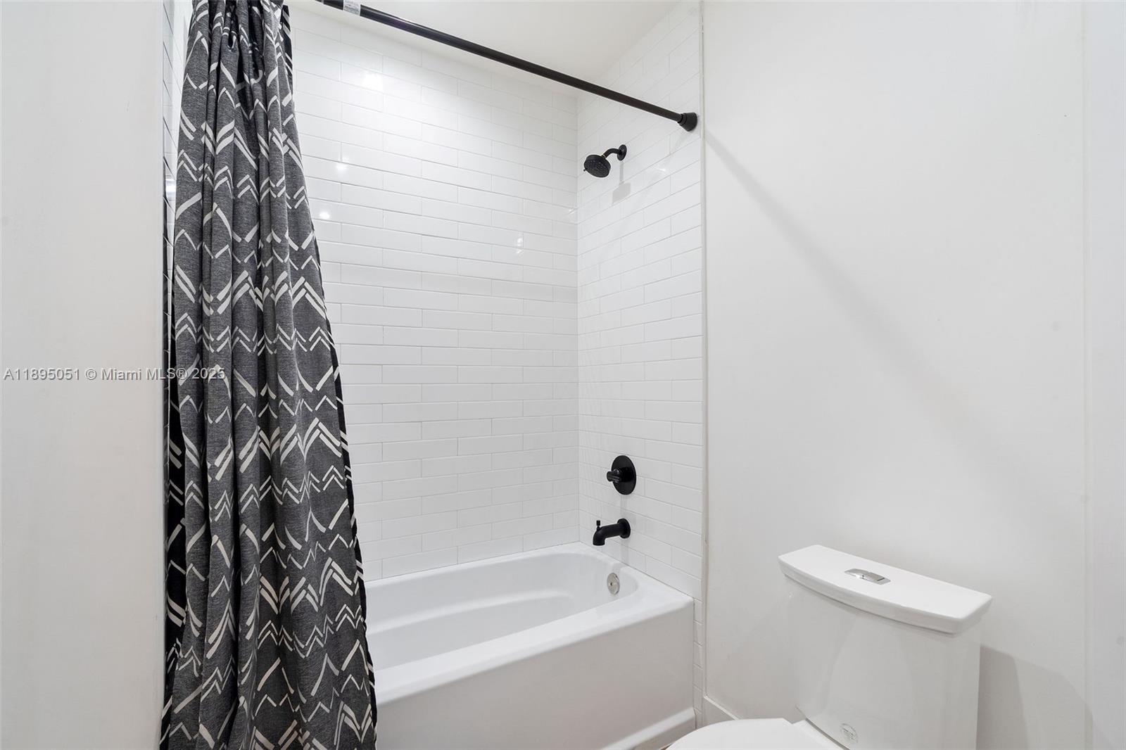 8121 Southwest 97th Terrace Miami, FL 33156 - Photo 37 of 38 a bathroom with a bathtub and shower