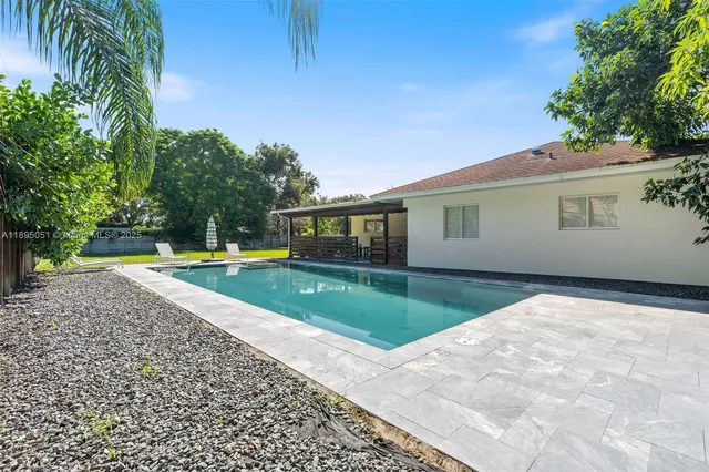 a house view with a backyard space