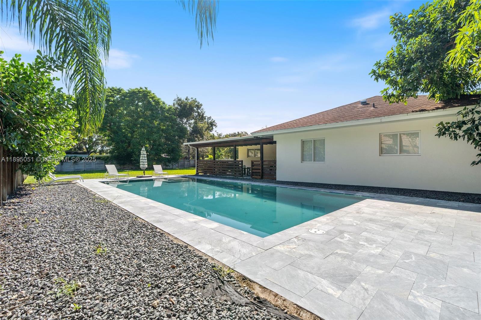 8121 Southwest 97th Terrace Miami, FL 33156 - Photo 6 of 38 a house view with a backyard space