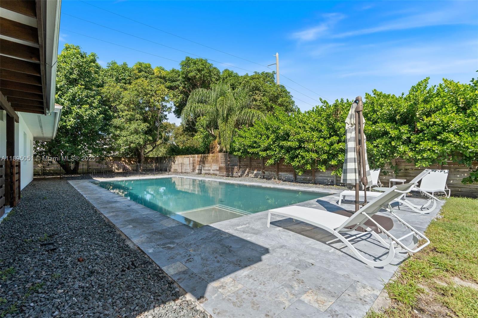 8121 Southwest 97th Terrace Miami, FL 33156 - Photo 8 of 38 a view of a patio with couches plants and large trees
