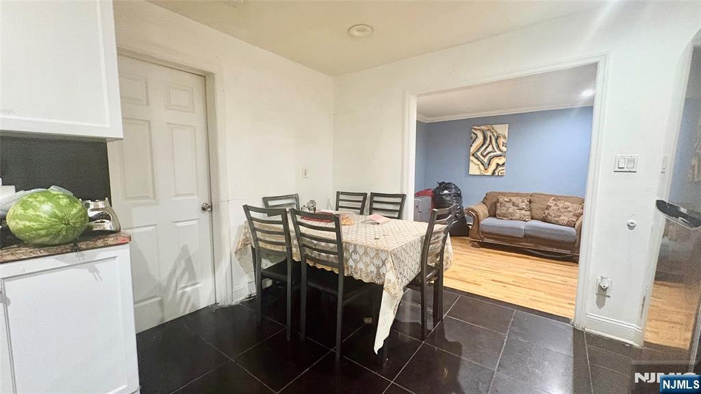 17 Cleveland Avenue, Unit 2 Harrison, NJ 07029 - Photo 5 of 12 a living room with furniture and a table