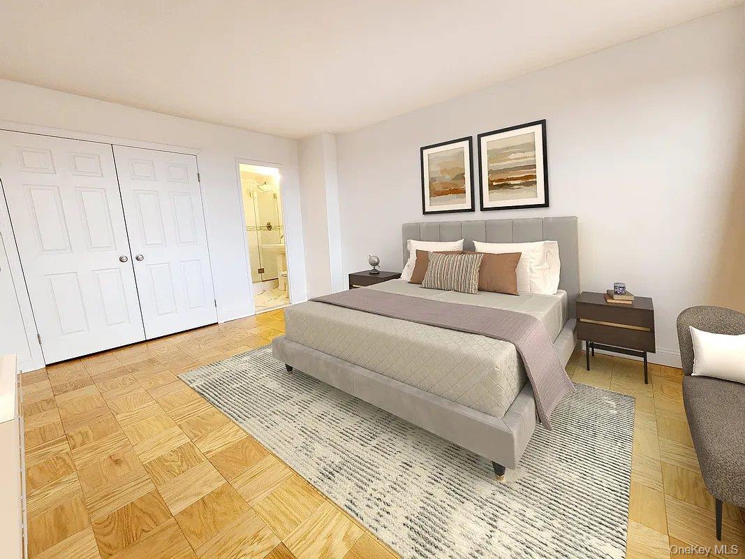 61-20 Grand Central Parkway, Unit A1406 Queens, NY 11375 - Photo 12 of 23 a bedroom with a bed a painting on the wall and a rug