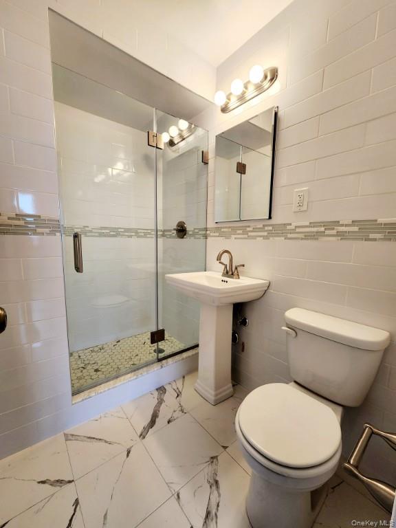 61-20 Grand Central Parkway, Unit A1406 Queens, NY 11375 - Photo 15 of 23 a bathroom with a sink toilet and shower