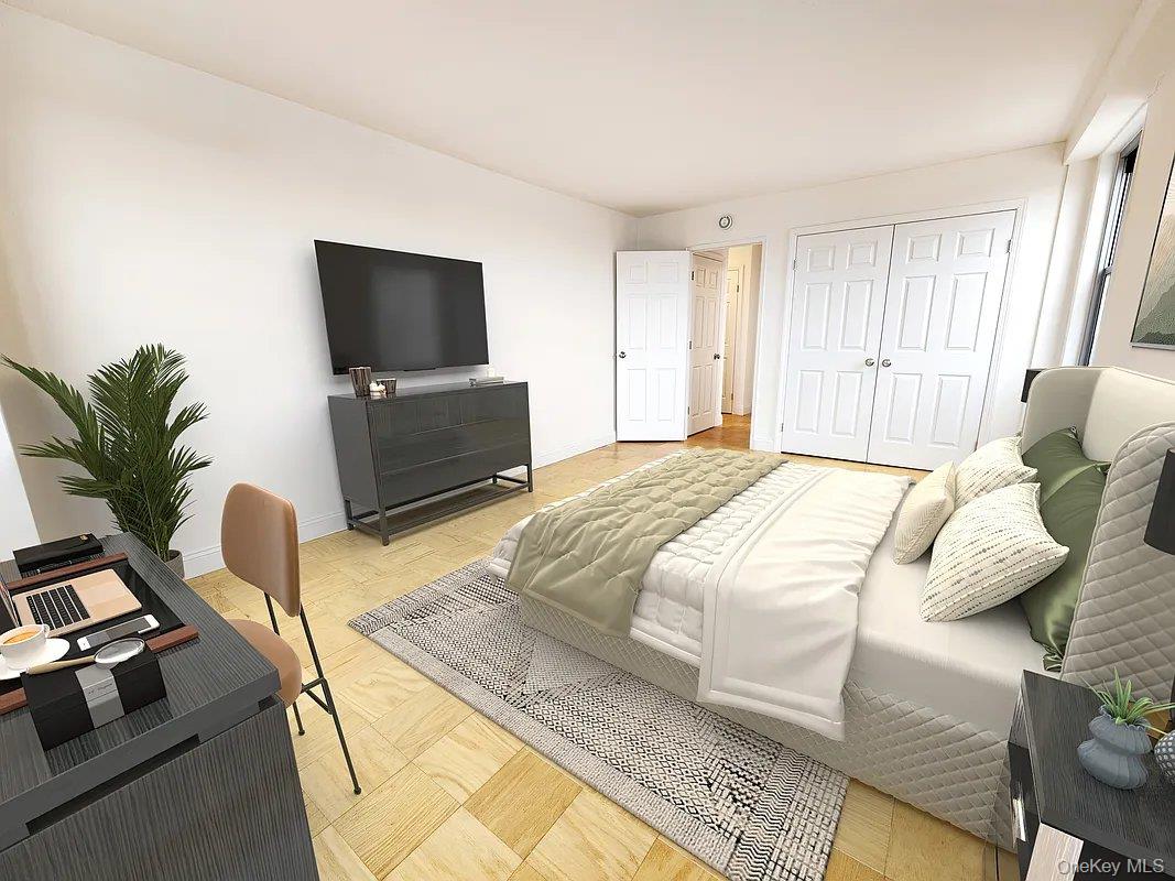 61-20 Grand Central Parkway, Unit A1406 Queens, NY 11375 - Photo 17 of 23 a bedroom with a bed and a flat screen tv