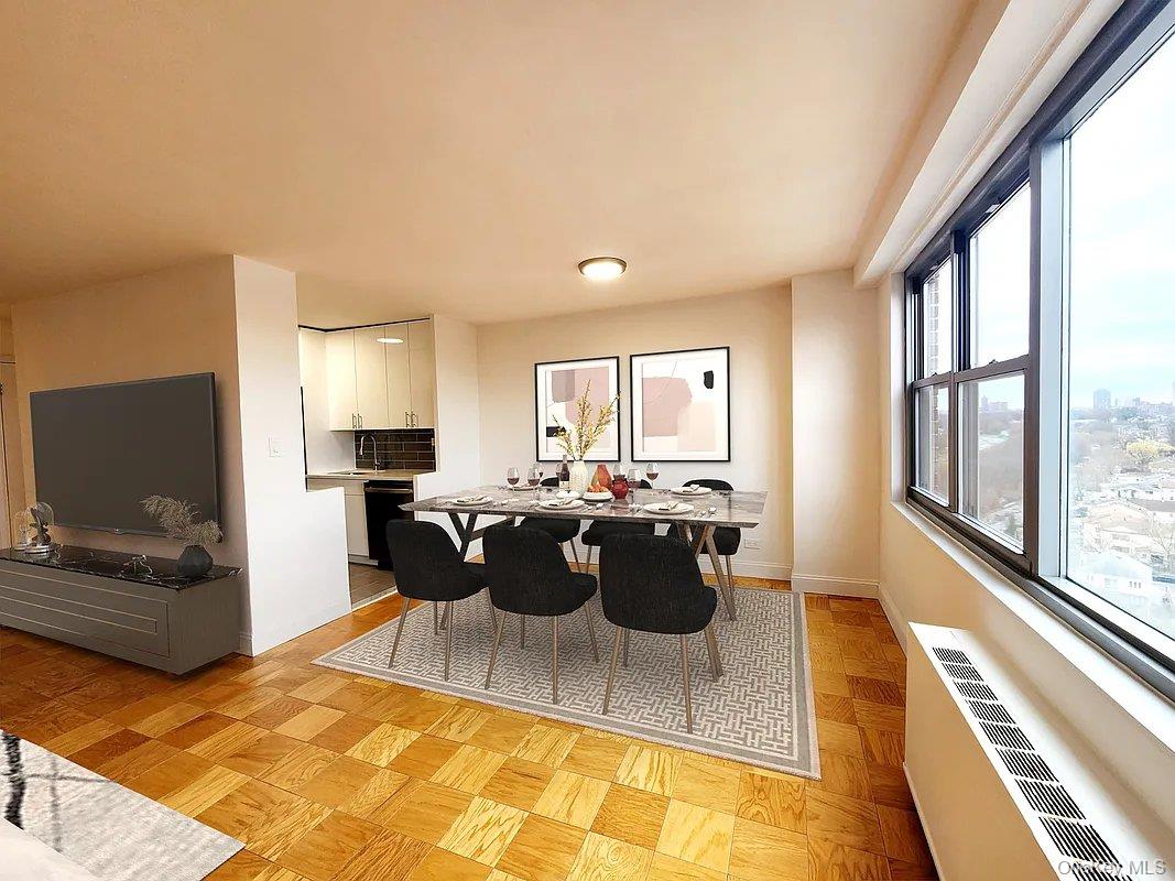 61-20 Grand Central Parkway, Unit A1406 Queens, NY 11375 - Photo 2 of 23 a view of a living room and kitchen with furniture