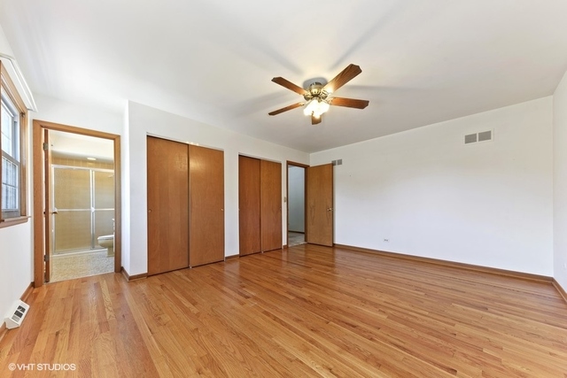 560 North Rohlwing Road Palatine, IL 60074 - Photo 16 of 25 an empty room with wooden floor and door