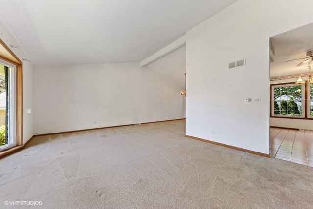 560 North Rohlwing Road Palatine, IL 60074 - Photo 5 of 25 an empty room with windows