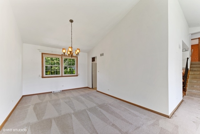 560 North Rohlwing Road Palatine, IL 60074 - Photo 7 of 25 a view of an empty room with windows