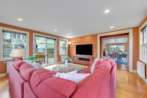 a living room with furniture and a flat screen tv