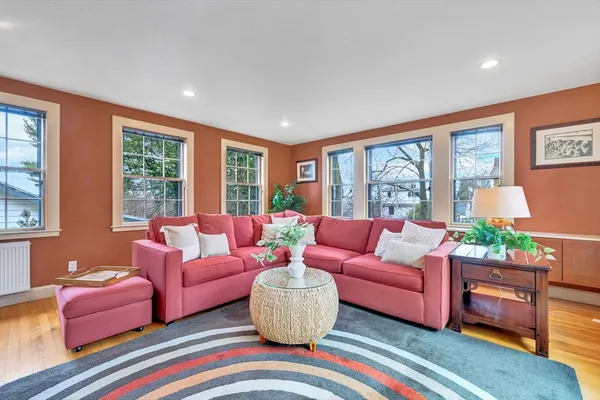 a living room with furniture and windows