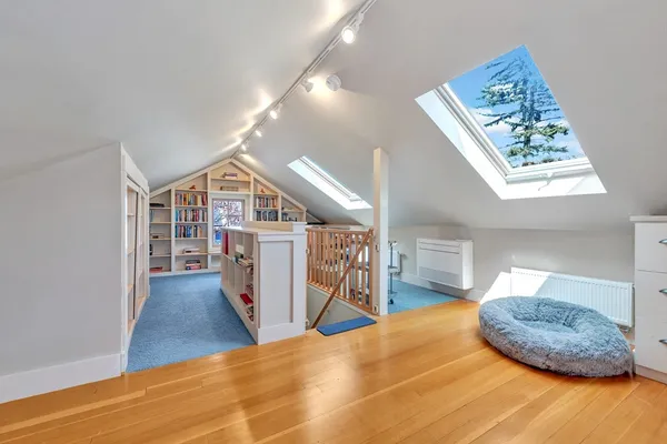a view of a livingroom with furniture and wooden floor