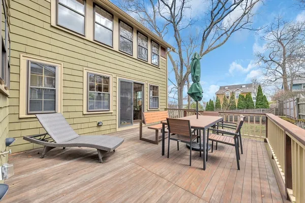 a view of a patio with a table and chairs