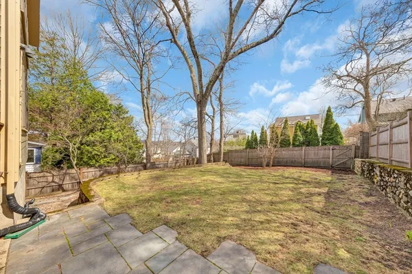 a view of a yard with a house and trees