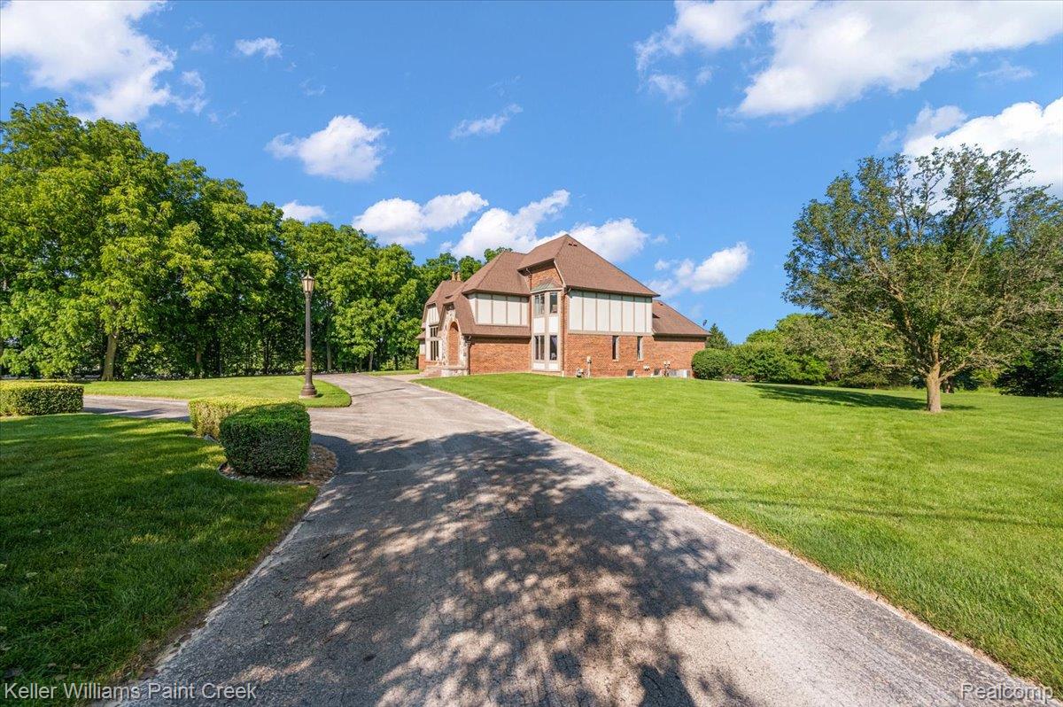 69069 Campground Road Romeo, MI 48065 - Photo 5 of 78 Expansive brick exterior with a multi-gabled roofline