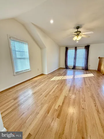 a view of kitchen with cabinets stainless steel appliances and a fireplace