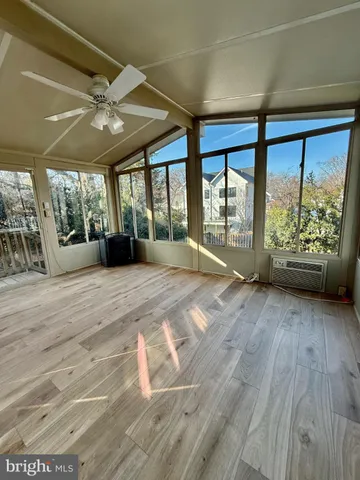 a view of an empty room with a large window