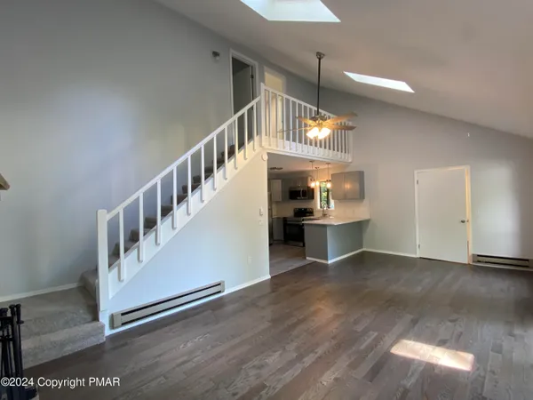 a view of an entryway with a kitchen