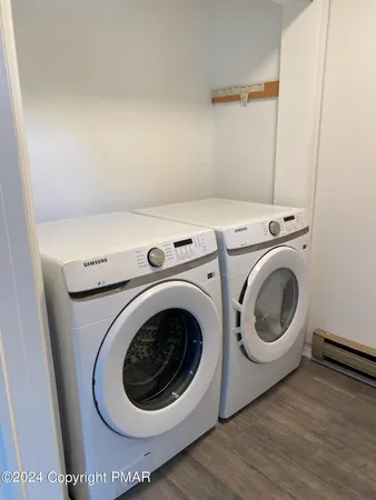 a utility room with dryer and washer
