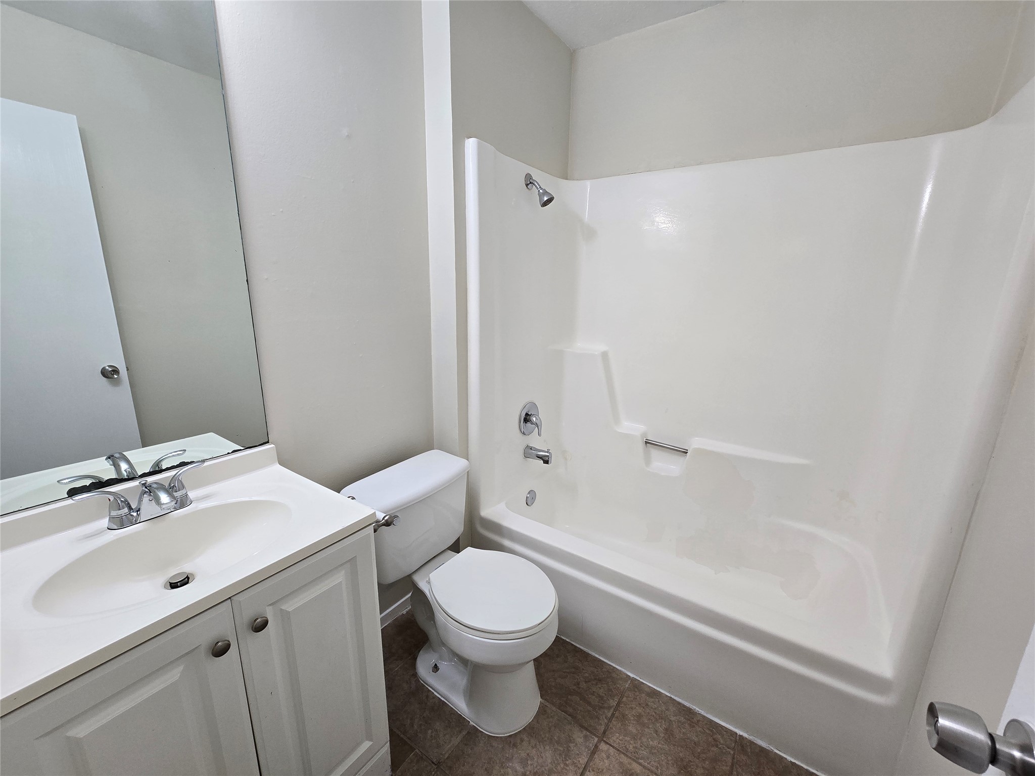6206 Buffalo Pass, Unit A Austin, TX 78745 - Photo 17 of 24 This bathroom features a sleek vanity and a combined shower-tub unit for practical everyday living.