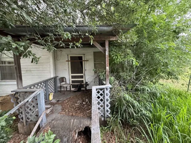 a view of house with patio outdoor seating