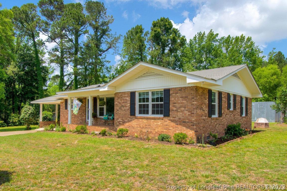 1541 3 Bridge Road Dunn, NC 28334 - Photo 2 of 32 a front view of house with yard and green space