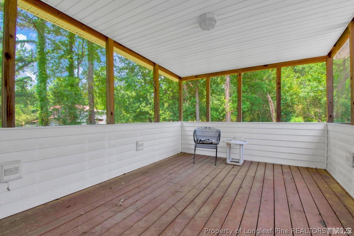 1541 3 Bridge Road Dunn, NC 28334 - Photo 26 of 32 a view of a two room with wooden floor and outdoor space