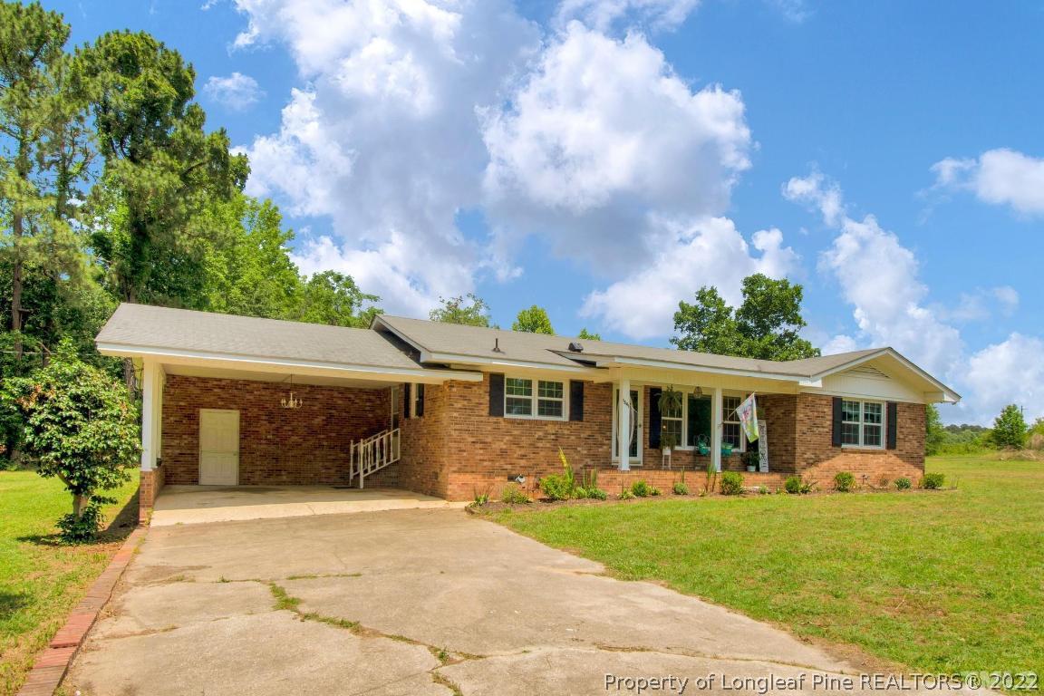 1541 3 Bridge Road Dunn, NC 28334 - Photo 3 of 32 a front view of a house with garden