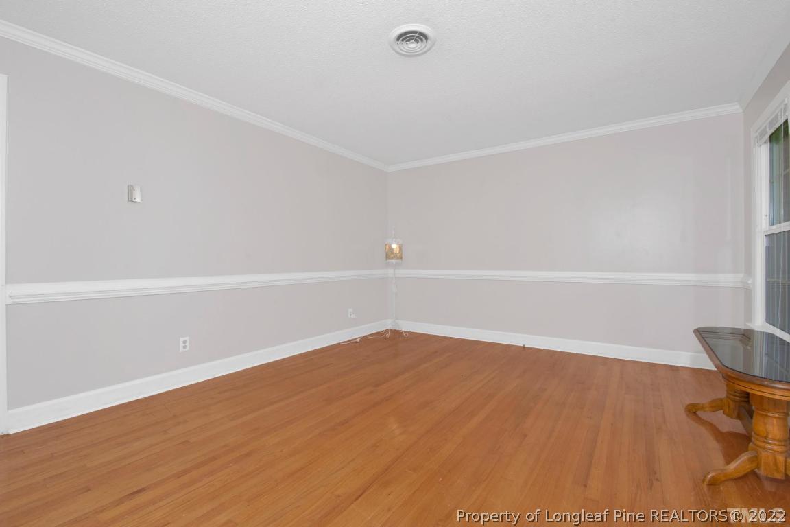 1541 3 Bridge Road Dunn, NC 28334 - Photo 9 of 32 a view of an empty room with wooden floor