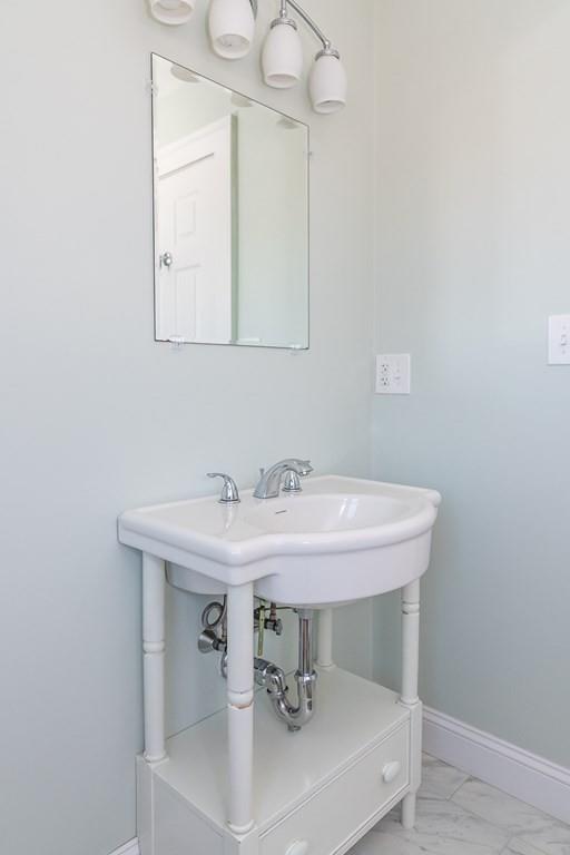 12 Pine Plain Road Wellesley, MA 02481 - Photo 21 of 30 a bathroom with a sink and a mirror