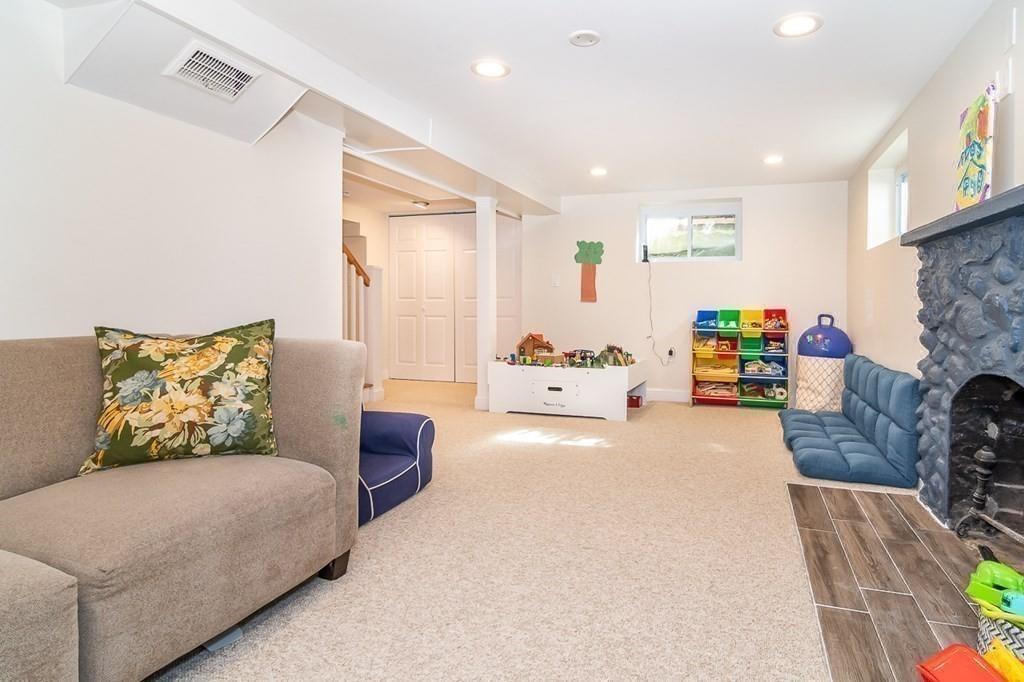 12 Pine Plain Road Wellesley, MA 02481 - Photo 24 of 30 a bedroom with furniture and a couch