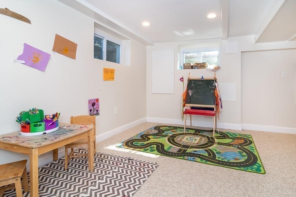 12 Pine Plain Road Wellesley, MA 02481 - Photo 25 of 30 a bedroom with a bed and a dresser
