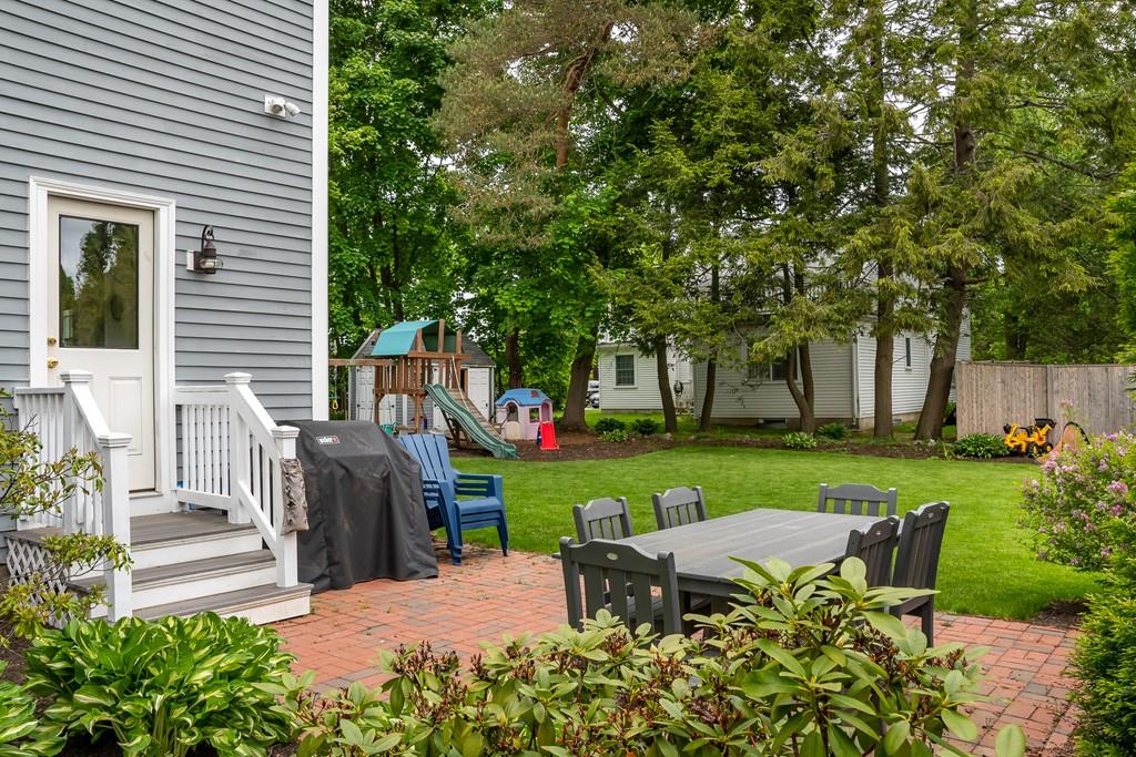 12 Pine Plain Road Wellesley, MA 02481 - Photo 26 of 30 a view of a house with backyard sitting area and garden