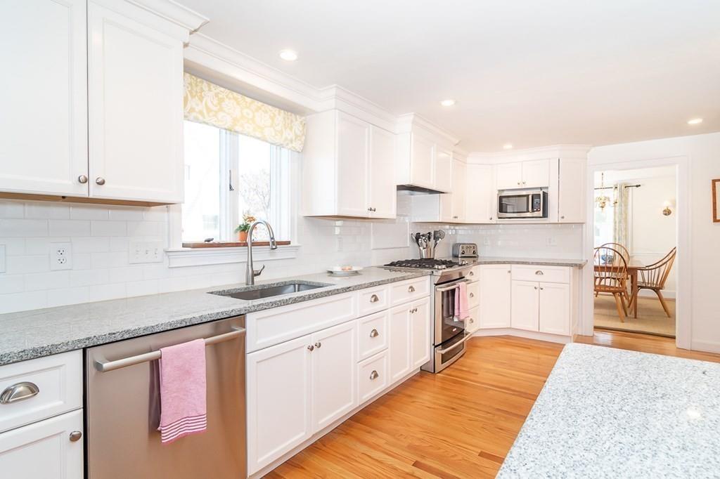 12 Pine Plain Road Wellesley, MA 02481 - Photo 4 of 30 a kitchen with stainless steel appliances granite countertop a sink and cabinets