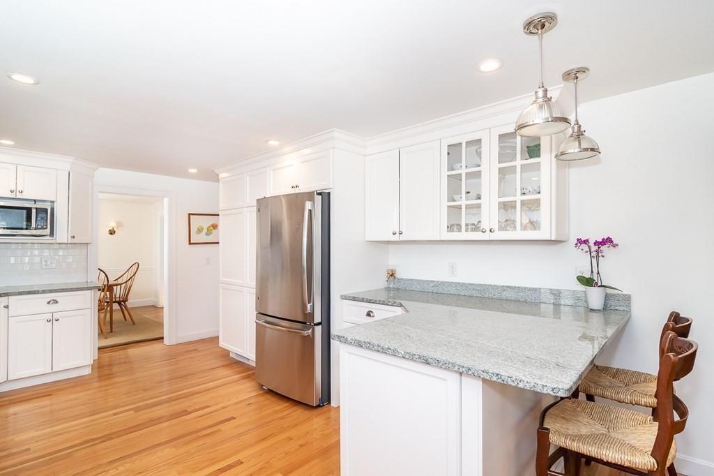 12 Pine Plain Road Wellesley, MA 02481 - Photo 5 of 30 a kitchen with granite countertop a refrigerator and a stove top oven