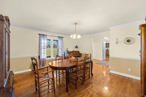 a kitchen with refrigerator and cabinets