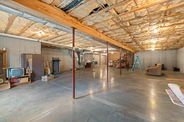 a view of a garage with a table and chairs