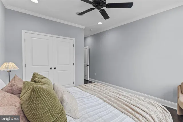 a bathroom with a granite countertop toilet sink and mirror