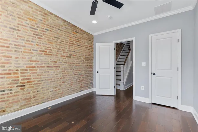 a view of room with window and hardwood floor