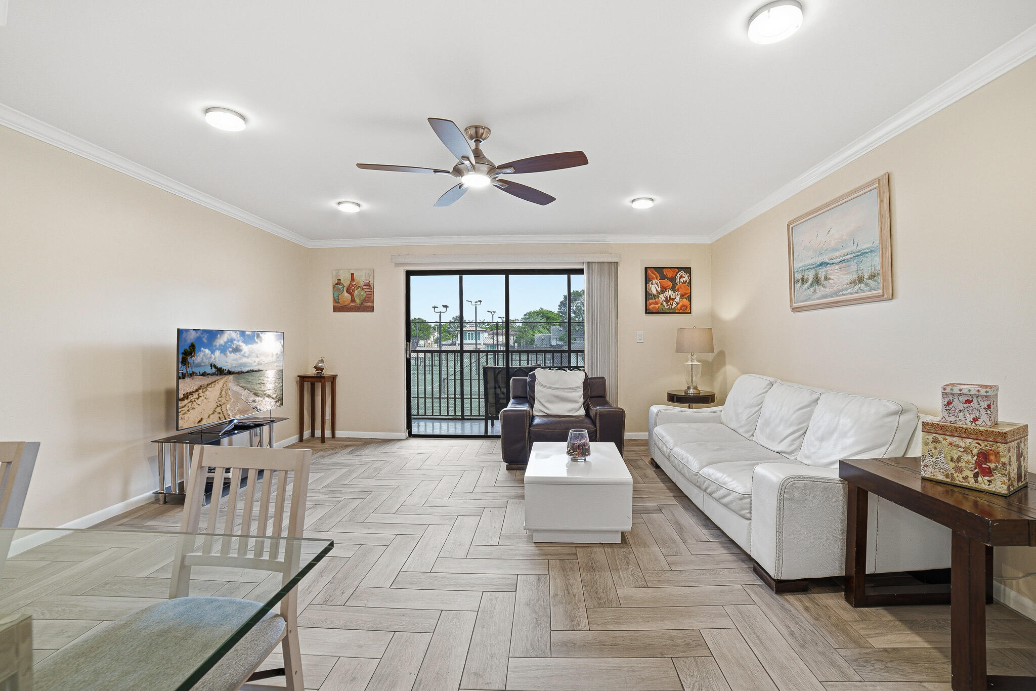 105 Deer Creek Road Deerfield Beach, FL 33442 - Photo 1 of 18 a living room with furniture and a floor to ceiling window