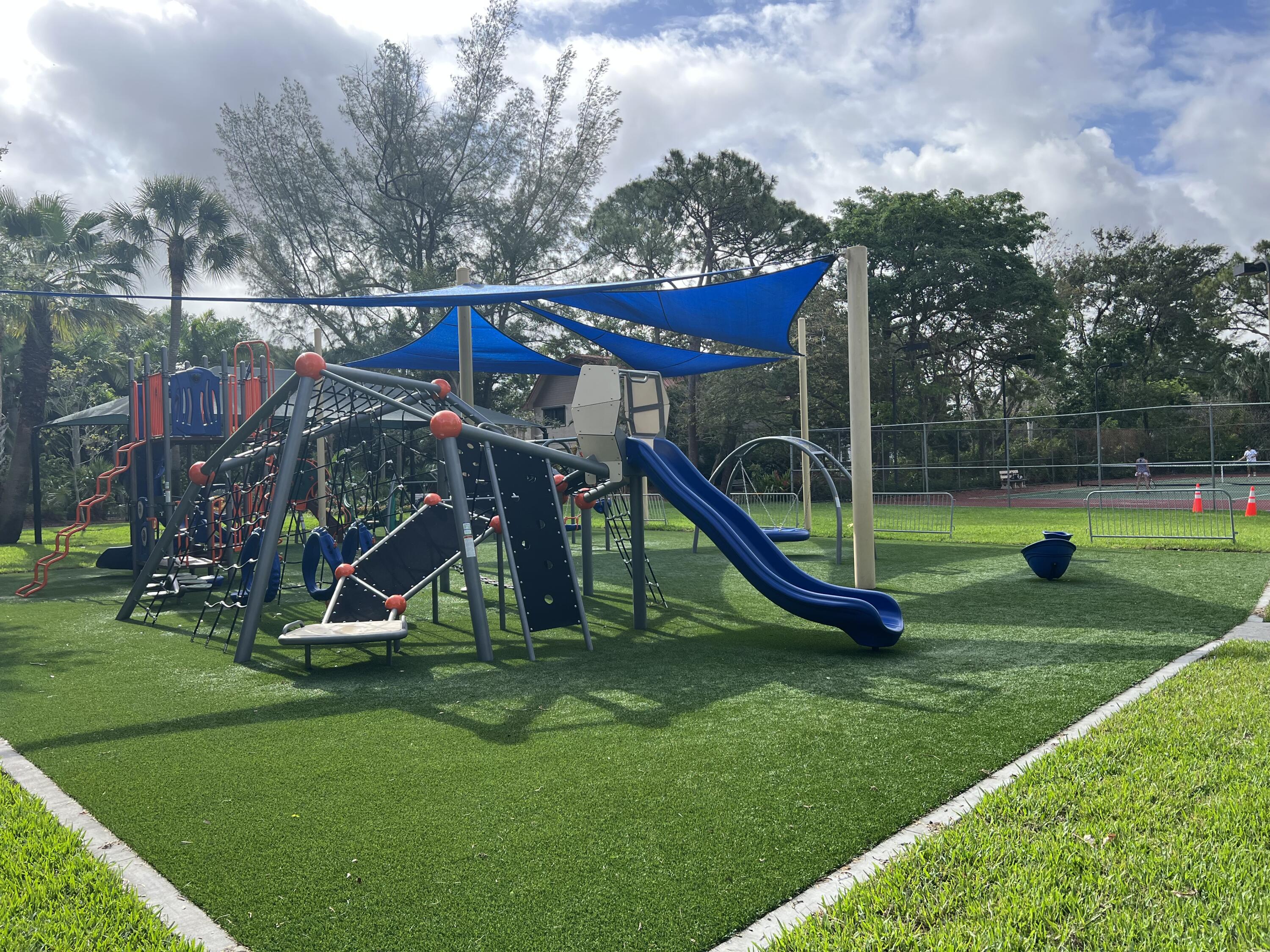 105 Deer Creek Road Deerfield Beach, FL 33442 - Photo 15 of 18 a view of a park with a slide