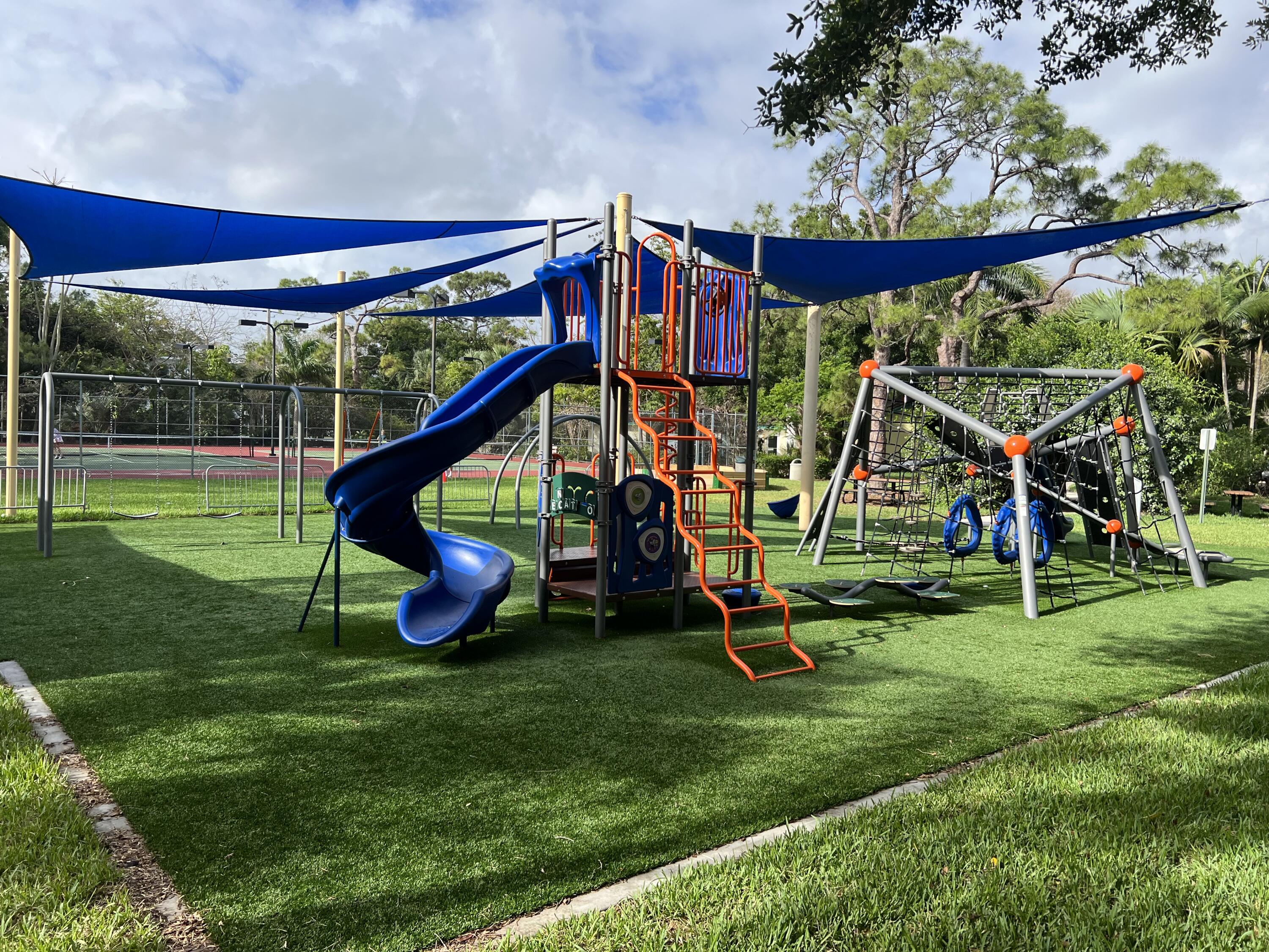 105 Deer Creek Road Deerfield Beach, FL 33442 - Photo 16 of 18 a view of a park with a slide