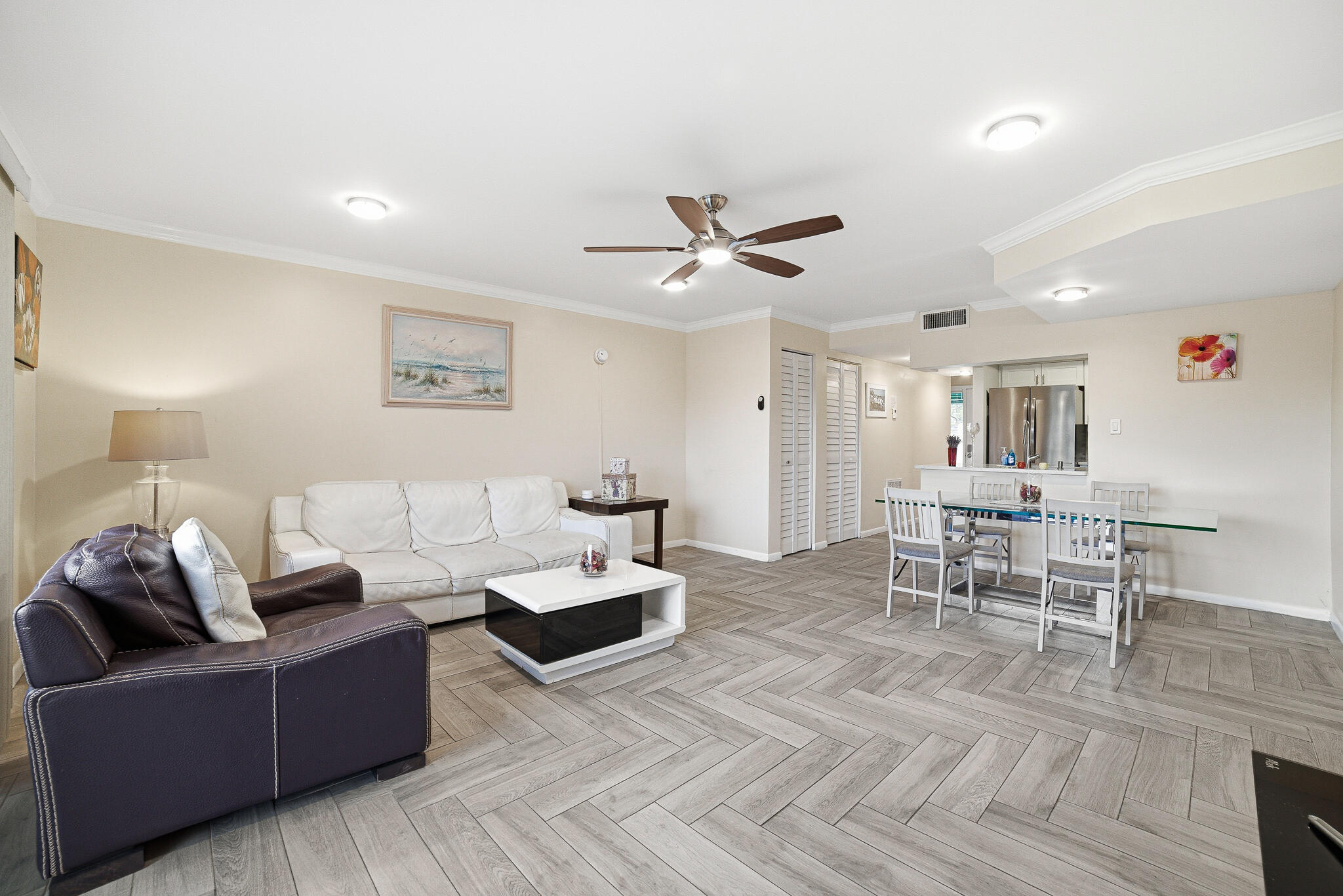 105 Deer Creek Road Deerfield Beach, FL 33442 - Photo 4 of 18 a living room with furniture and view of kitchen