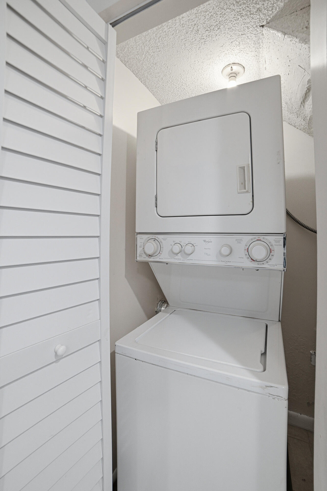105 Deer Creek Road Deerfield Beach, FL 33442 - Photo 9 of 18 a utility room with dryer and washer