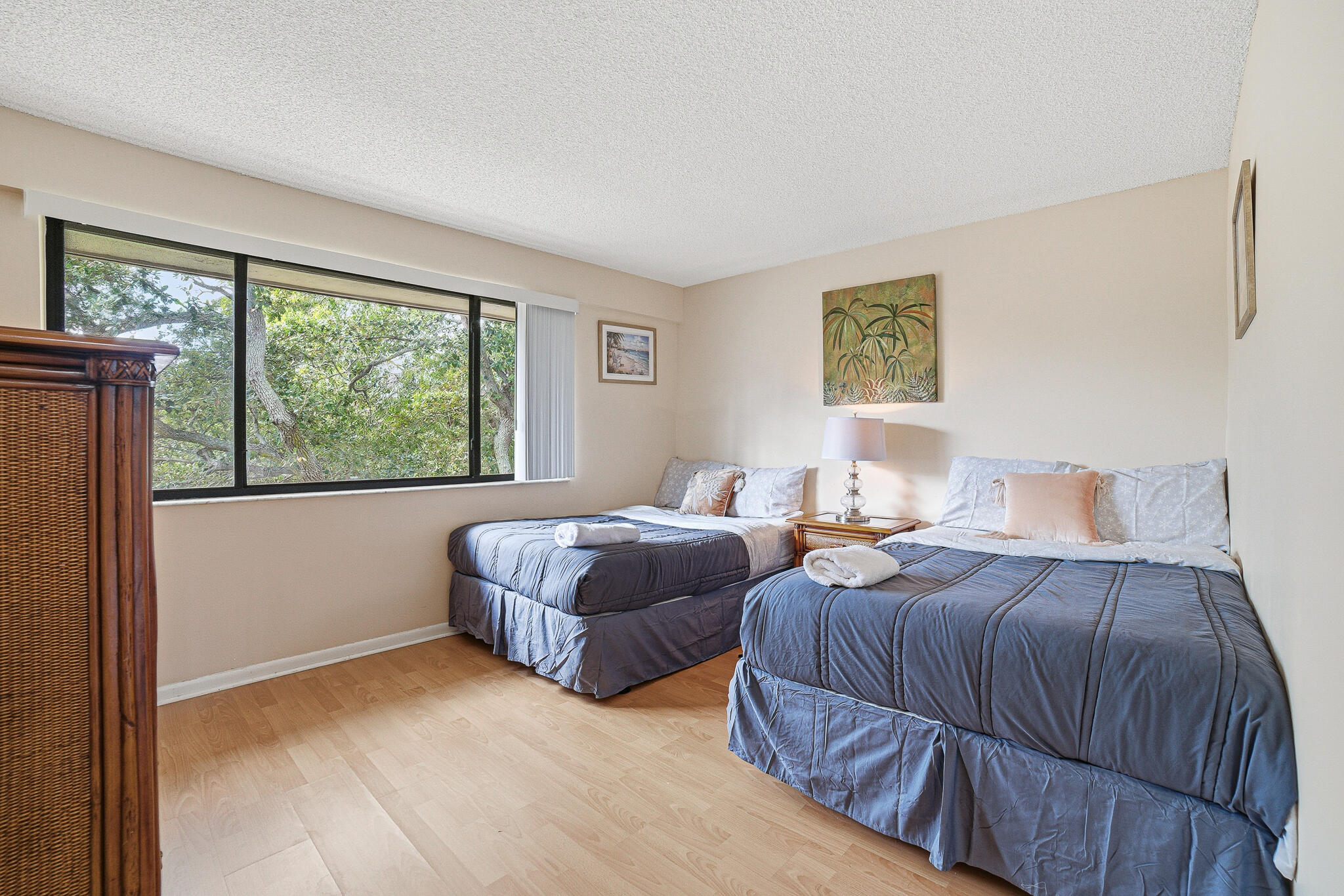 105 Deer Creek Road Deerfield Beach, FL 33442 - Photo 10 of 18 a bedroom with two beds and a large window